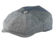 Patchwork flat cap on black background.